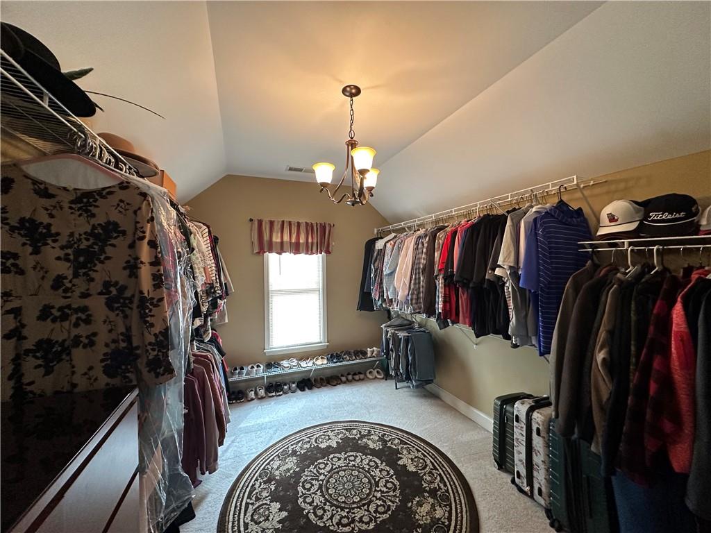121 Moose Loop Waleska, GA 30183 - Photo 38 of 57 a view of walk in closet with clothes and shoes