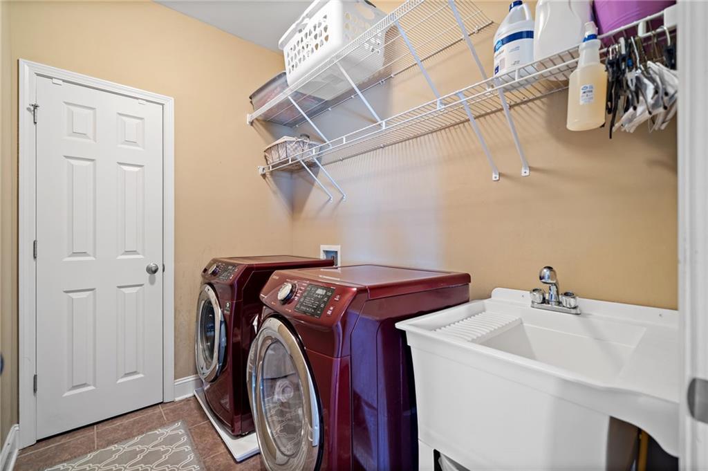 121 Moose Loop Waleska, GA 30183 - Photo 39 of 57 a utility room with dryer and washer