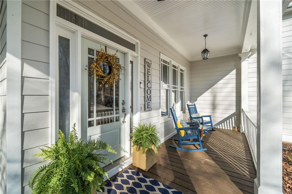 121 Moose Loop Waleska, GA 30183 - Photo 41 of 57 a view of balcony with chairs and potted plants