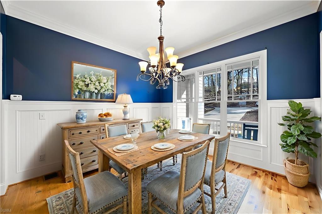 121 Moose Loop Waleska, GA 30183 - Photo 9 of 57 a view of a dining room with furniture window and wooden floor