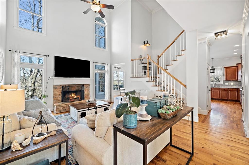 121 Moose Loop Waleska, GA 30183 - Photo 10 of 57 a living room with furniture a fireplace and a flat screen tv