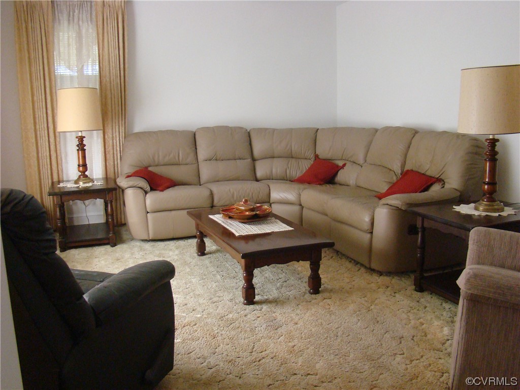 15320 Harrowgate Road Chester, VA 23831 - Photo 2 of 28 a living room with furniture and a lamp