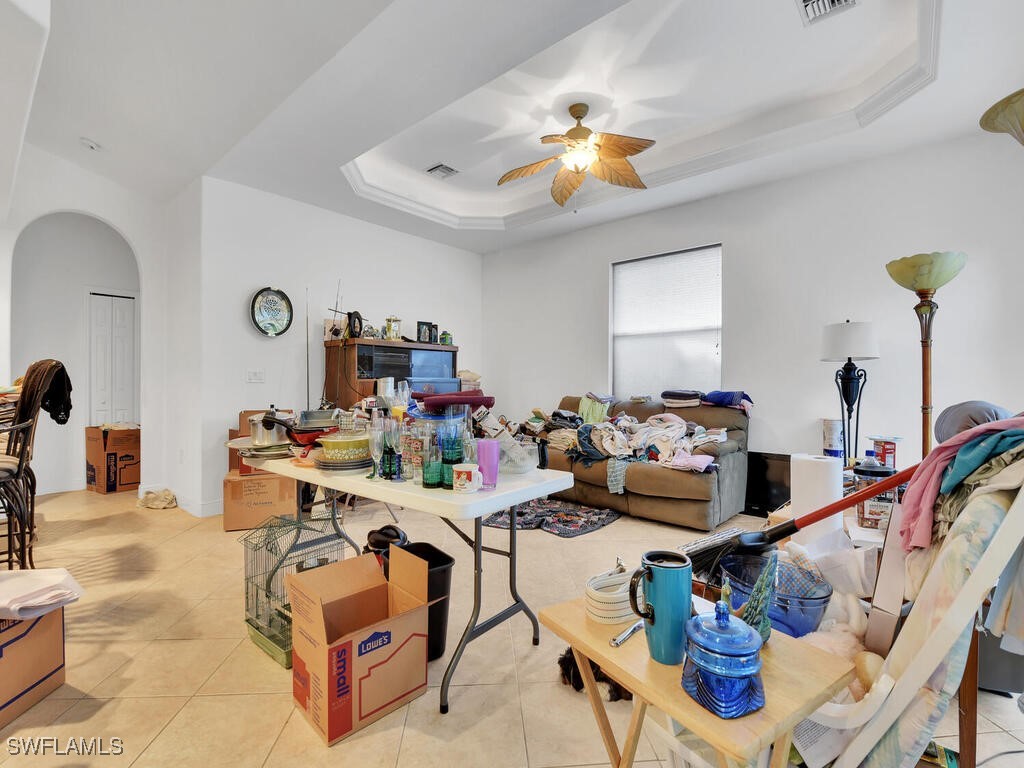 8123 Sandpiper Road Fort Myers, FL 33967 - Photo 12 of 23 a living room with furniture and a chandelier