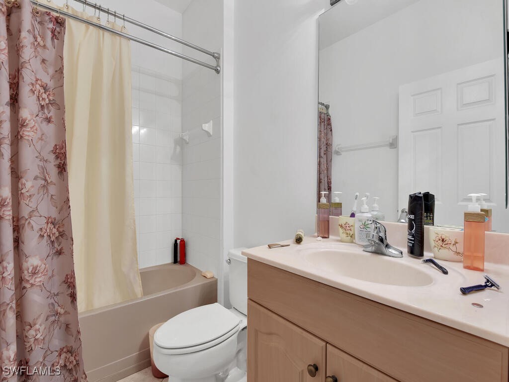8123 Sandpiper Road Fort Myers, FL 33967 - Photo 15 of 23 a bathroom with a sink a toilet and shower