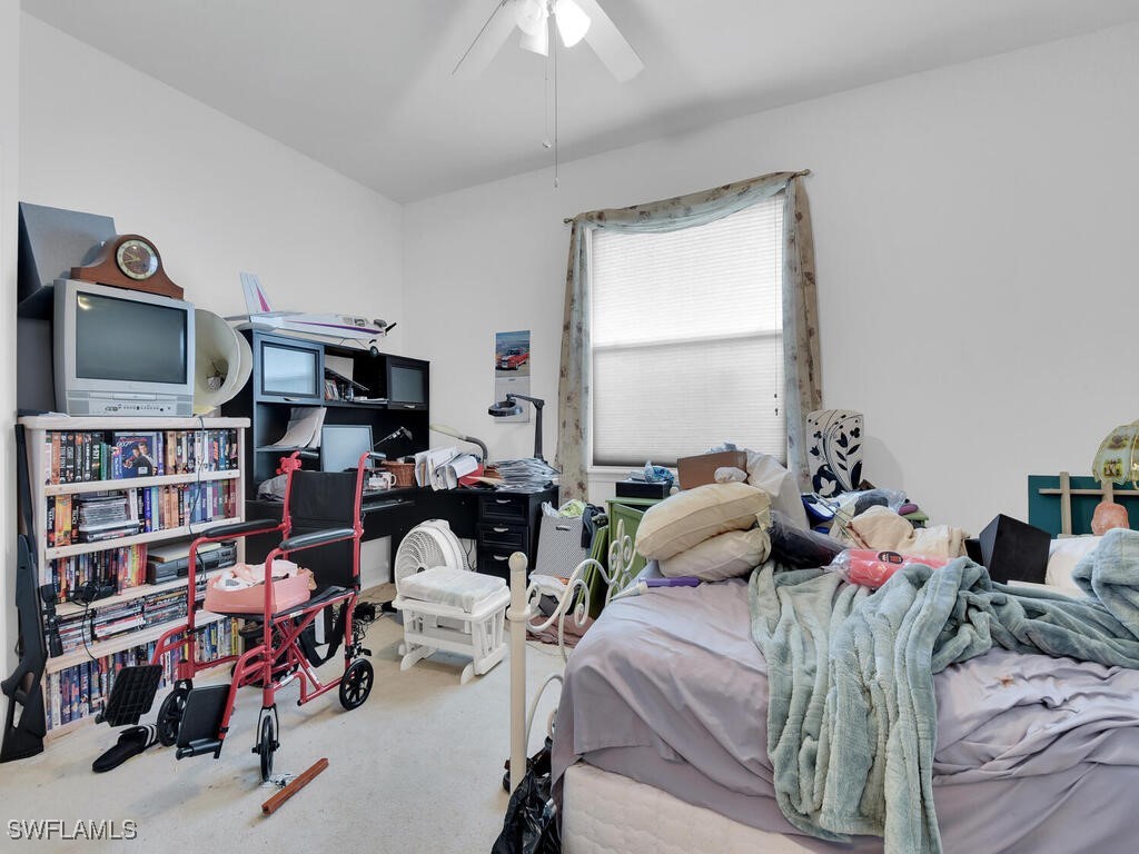 8123 Sandpiper Road Fort Myers, FL 33967 - Photo 19 of 23 a bedroom with furniture and a window