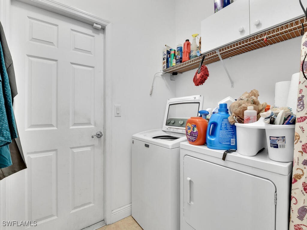 8123 Sandpiper Road Fort Myers, FL 33967 - Photo 21 of 23 a storage room with washer and dryer