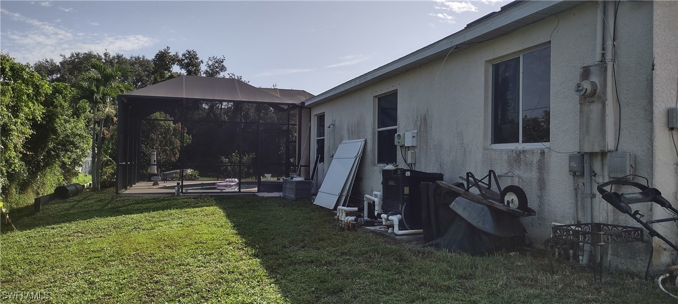 8123 Sandpiper Road Fort Myers, FL 33967 - Photo 4 of 23 a view of a house with backyard and a slide