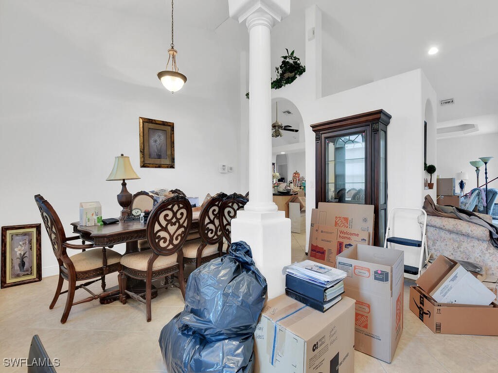 8123 Sandpiper Road Fort Myers, FL 33967 - Photo 9 of 23 a living room with furniture and a large mirror