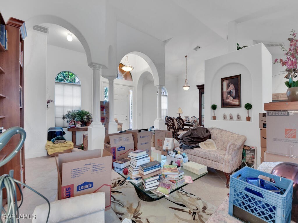 8123 Sandpiper Road Fort Myers, FL 33967 - Photo 10 of 23 a living room with furniture and a mirror