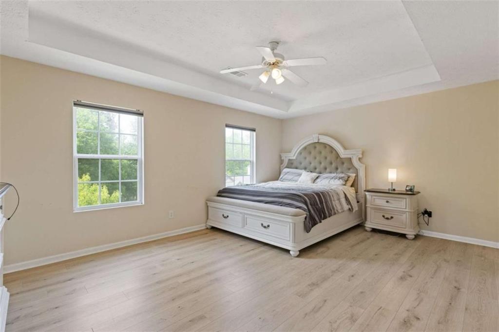 1450 Steam Engine Way Northeast Conyers, GA 30013 - Photo 17 of 33 a spacious bedroom with a bed and window