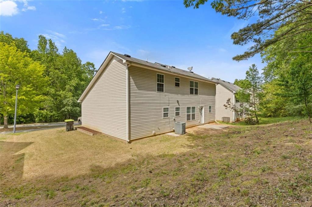 1450 Steam Engine Way Northeast Conyers, GA 30013 - Photo 25 of 33 a view of a house with a yard