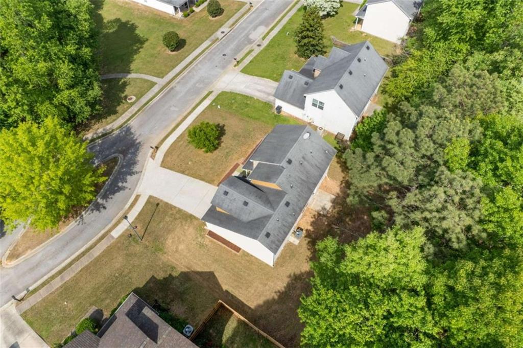 1450 Steam Engine Way Northeast Conyers, GA 30013 - Photo 30 of 33 an aerial view of a house with a yard