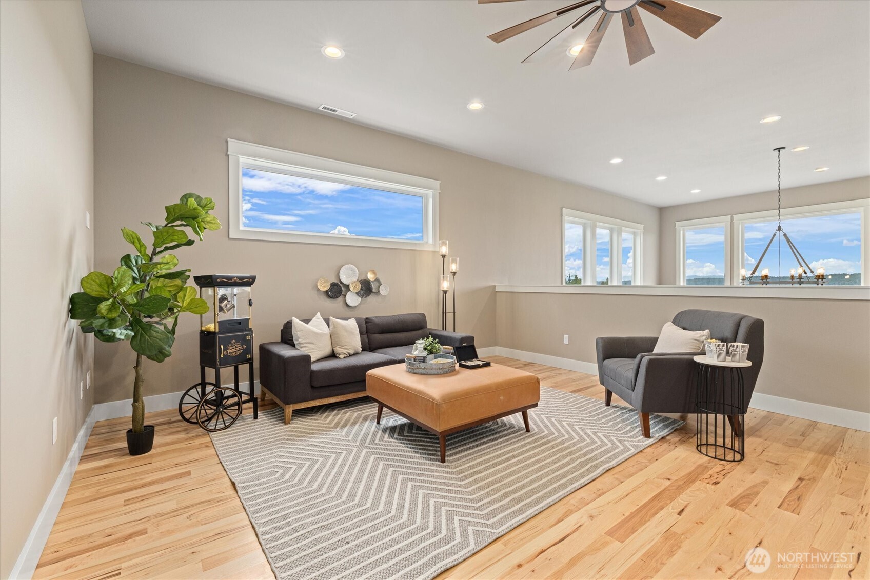 151 East Windy Ridge Lane Belfair, WA 98528 - Photo 24 of 40 a living room with furniture and a potted plant