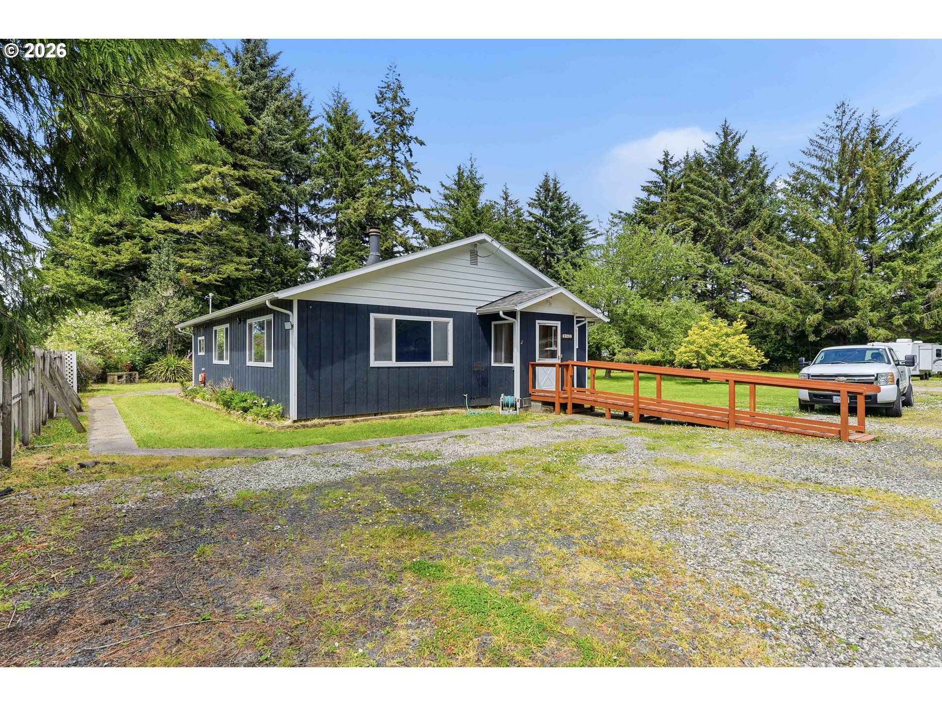 63299 Wildahl Road Coos Bay, OR 97420 - Photo 8 of 45 a front view of a house with a yard