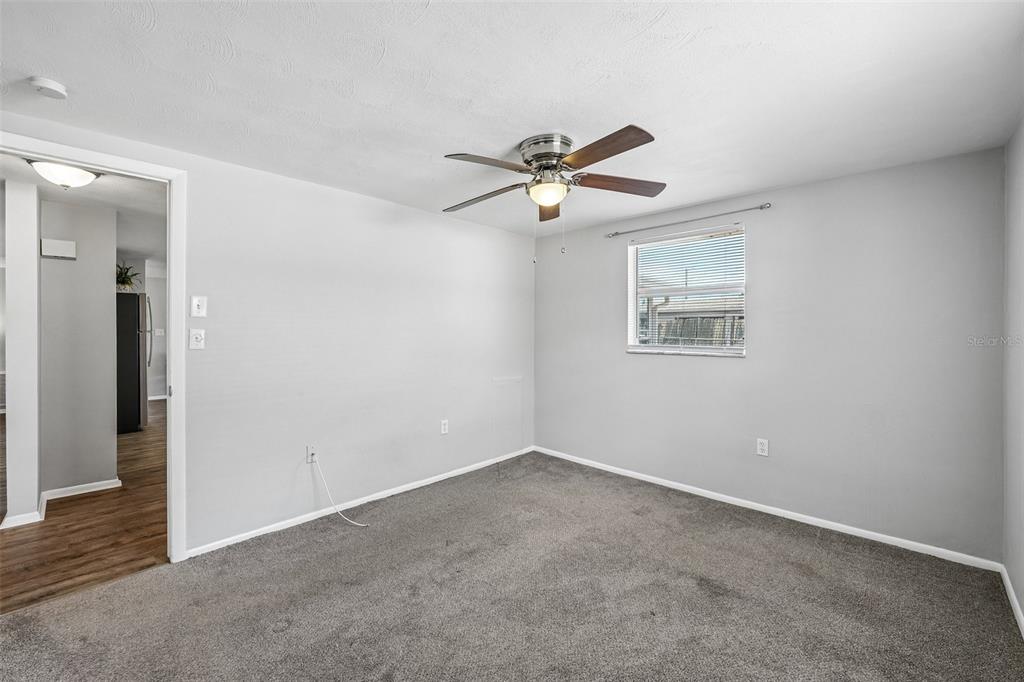 7215 Mayfield Drive Port Richey, FL 34668 - Photo 36 of 52 a view of room with ceiling fan