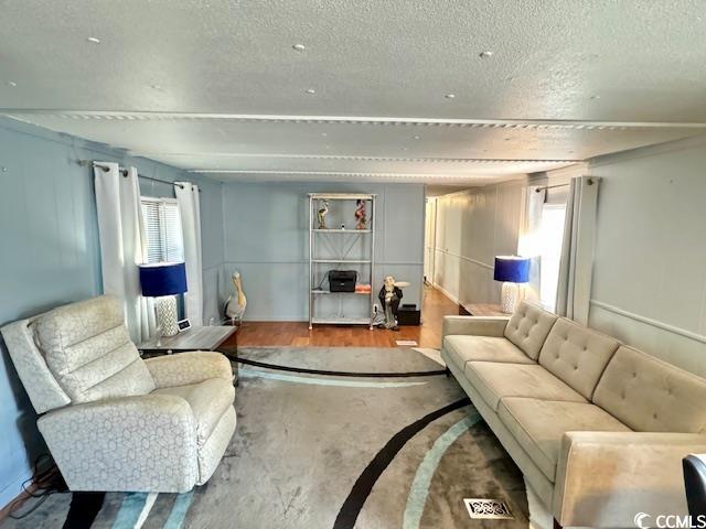 62 Offshore Drive Murrells Inlet, SC 29576 - Photo 8 of 22 Living area with a textured ceiling