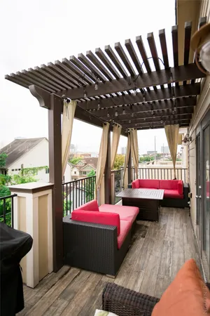 a view of balcony with a table and chairs