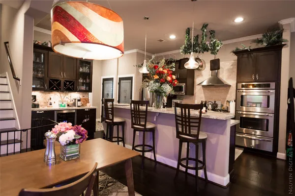 a kitchen with a table and chairs in it