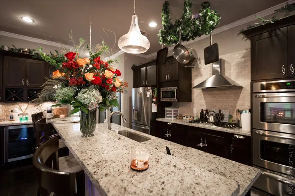 a kitchen with a table and chairs in it