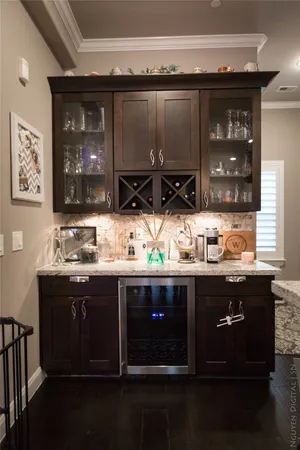 a kitchen with granite countertop a sink and cabinets