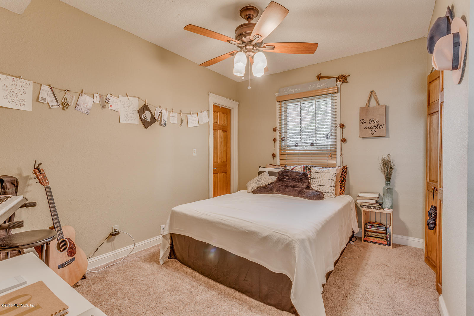 9 Riberia Street St. Augustine, FL 32084 - Photo 11 of 33 a bedroom with a bed and a chandelier