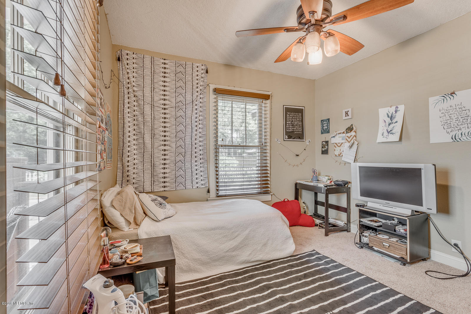9 Riberia Street St. Augustine, FL 32084 - Photo 12 of 33 a bedroom with a bed and a flat screen tv