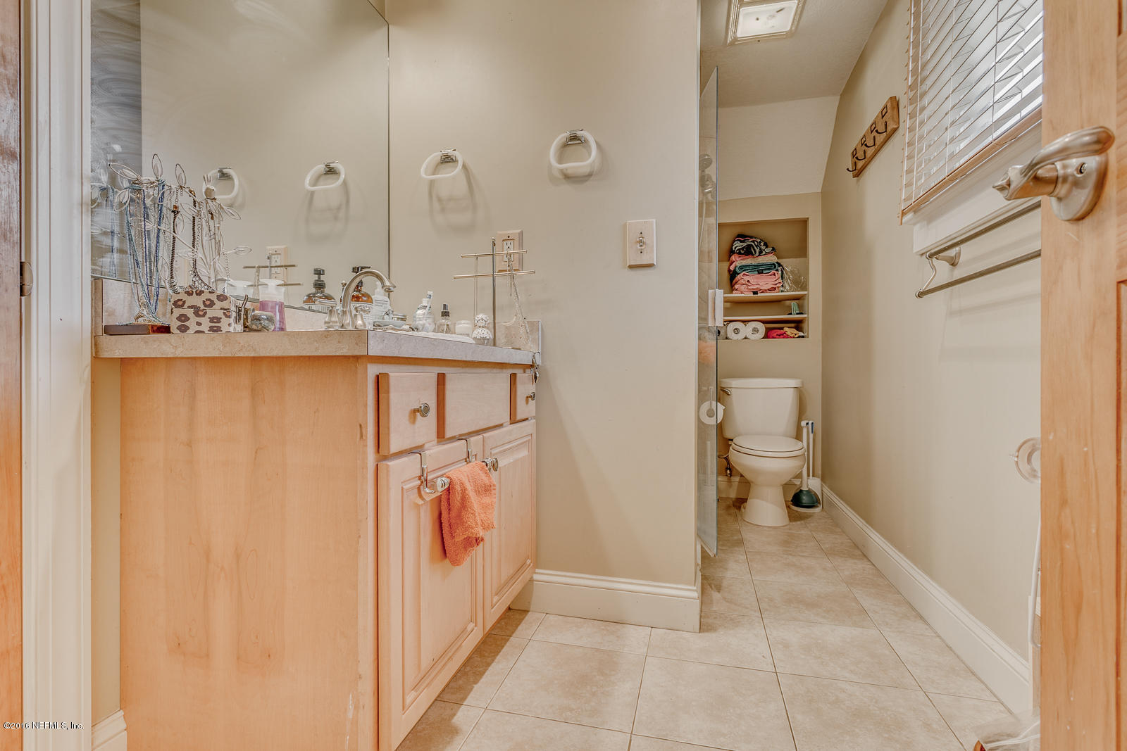 9 Riberia Street St. Augustine, FL 32084 - Photo 13 of 33 a bathroom with a sink a toilet and shower