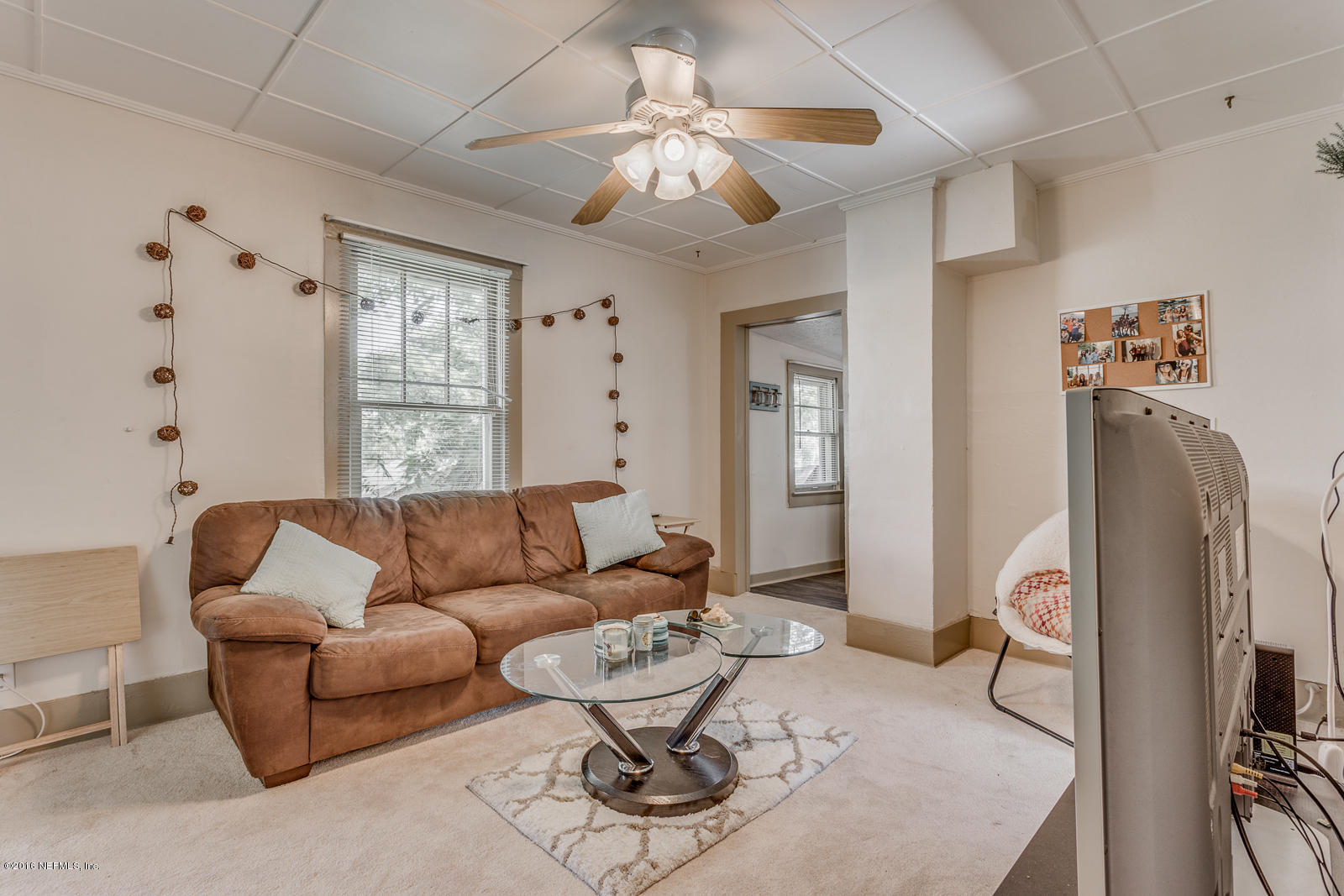 9 Riberia Street St. Augustine, FL 32084 - Photo 17 of 33 a living room with furniture and a large window