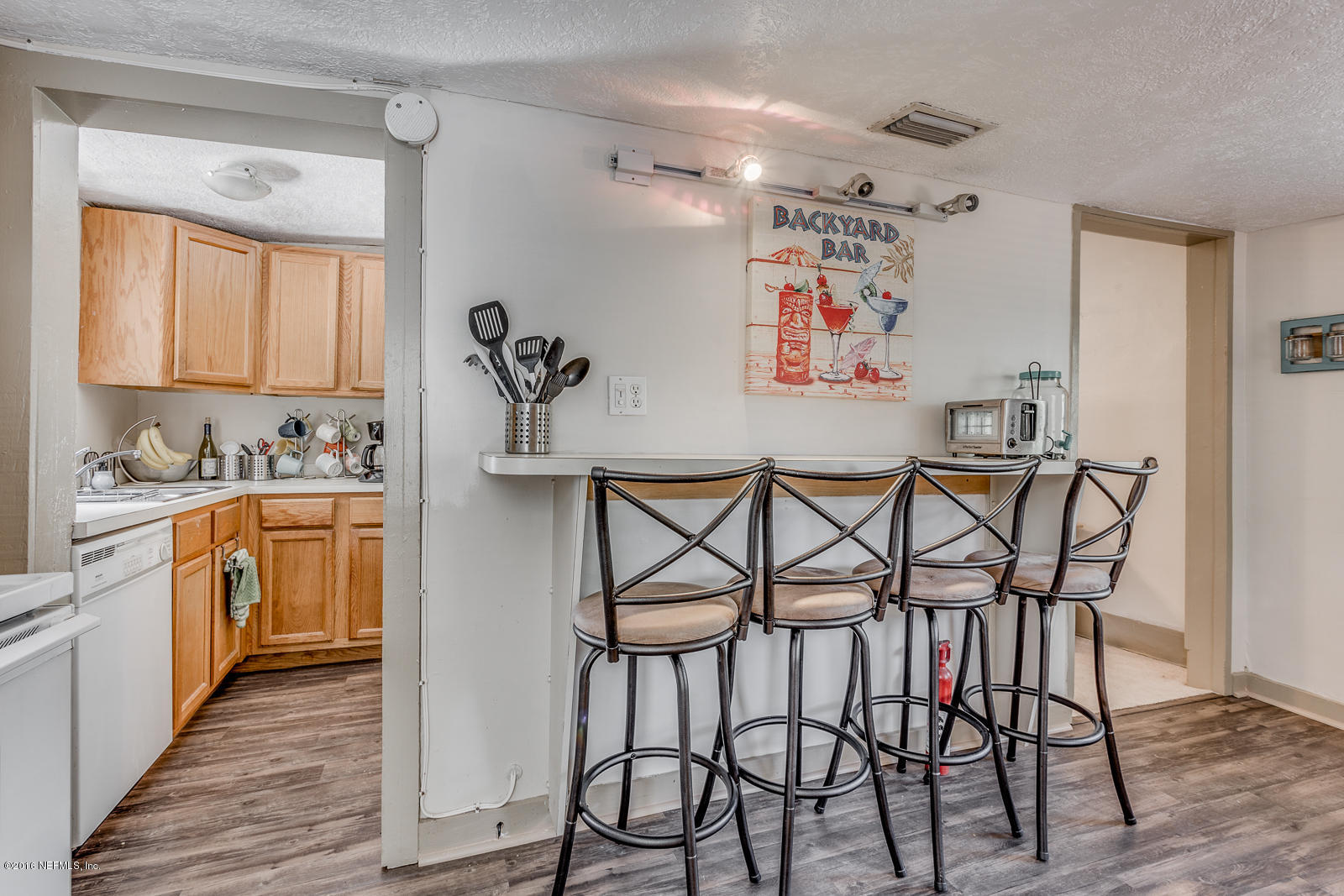 9 Riberia Street St. Augustine, FL 32084 - Photo 20 of 33 a view of a dining room with furniture kitchen and wooden floor