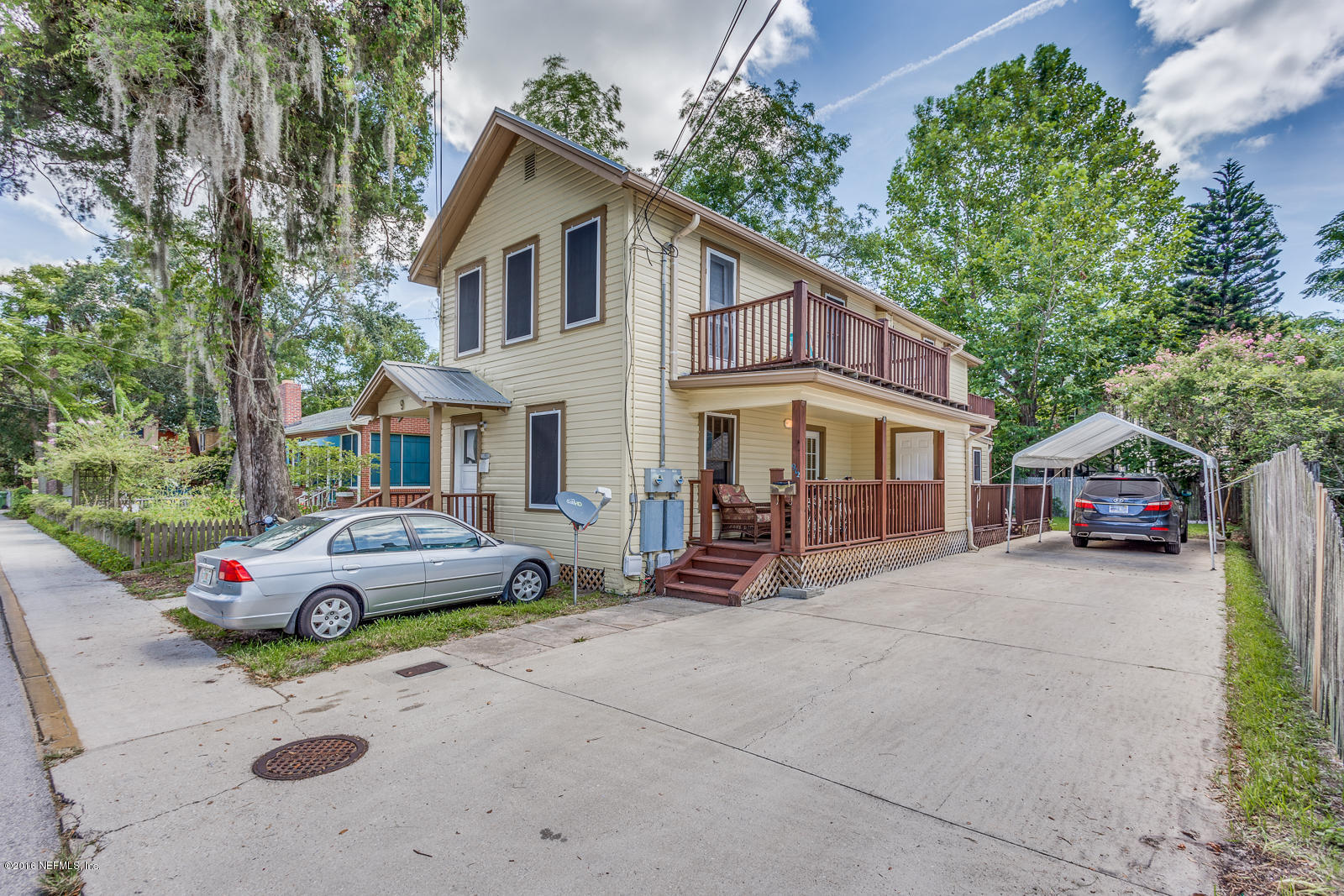 9 Riberia Street St. Augustine, FL 32084 - Photo 2 of 33 a car parked in front of a house