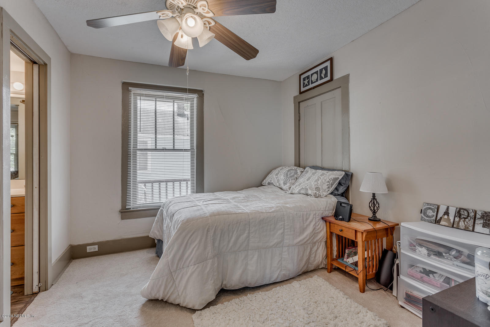 9 Riberia Street St. Augustine, FL 32084 - Photo 21 of 33 a bedroom with a bed and a window