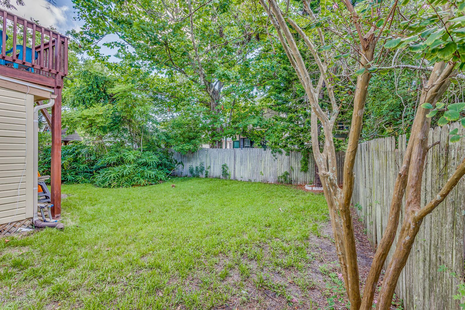9 Riberia Street St. Augustine, FL 32084 - Photo 28 of 33 a view of a backyard with a trees and plants