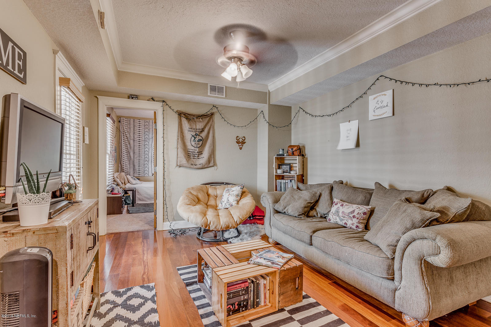 9 Riberia Street St. Augustine, FL 32084 - Photo 5 of 33 a living room with furniture and a chandelier