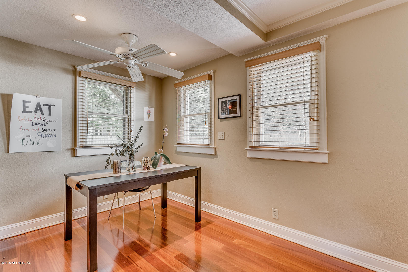 9 Riberia Street St. Augustine, FL 32084 - Photo 9 of 33 a workspace with wooden floor and windows
