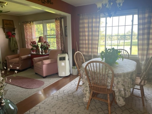 4059 Sunset Road Clinton, IL 61727 - Photo 12 of 55 a dining room with furniture and windows