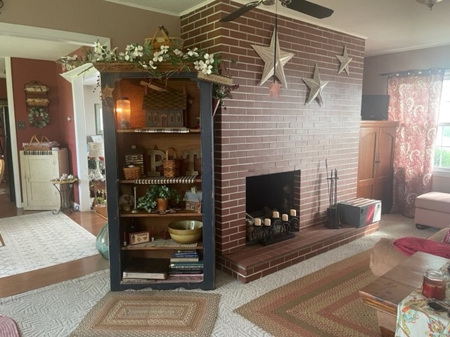 4059 Sunset Road Clinton, IL 61727 - Photo 16 of 55 a living room with furniture and a fireplace