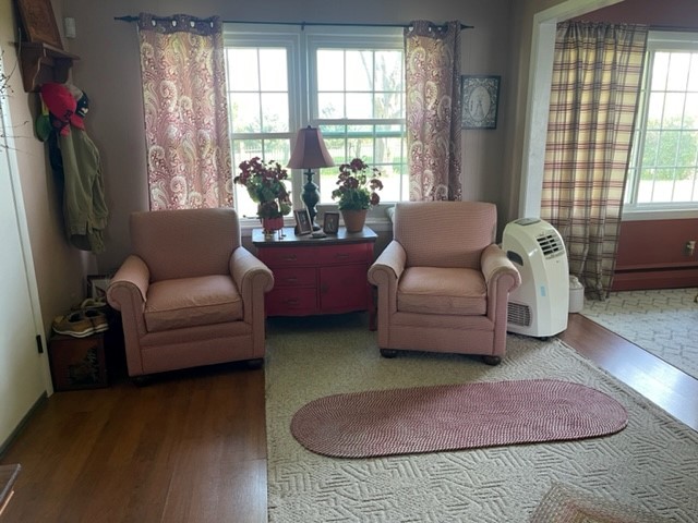 4059 Sunset Road Clinton, IL 61727 - Photo 17 of 55 a living room with furniture and a floor to ceiling window