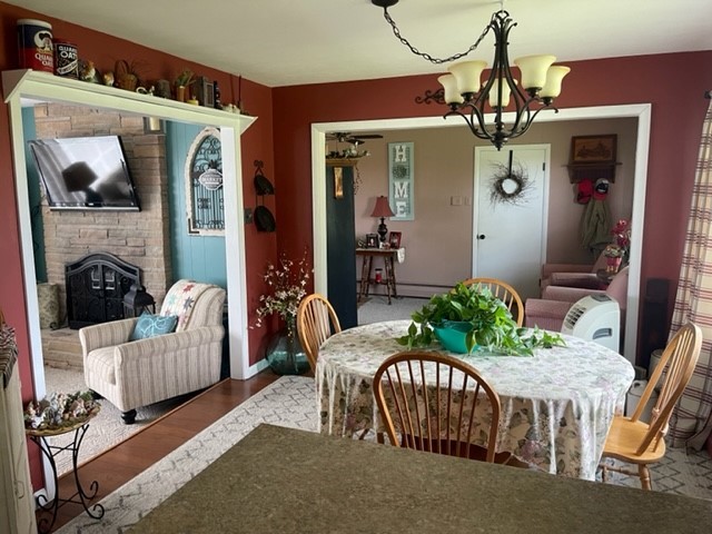 4059 Sunset Road Clinton, IL 61727 - Photo 19 of 55 a living room with furniture and a chandelier