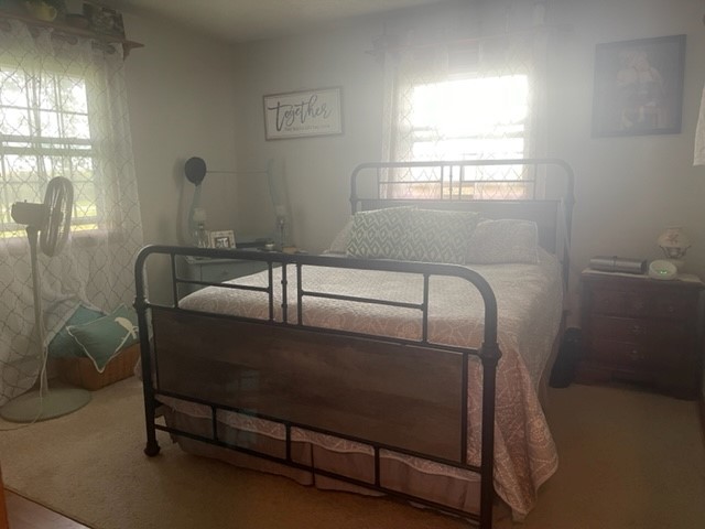 4059 Sunset Road Clinton, IL 61727 - Photo 26 of 55 a room with a bed and windows