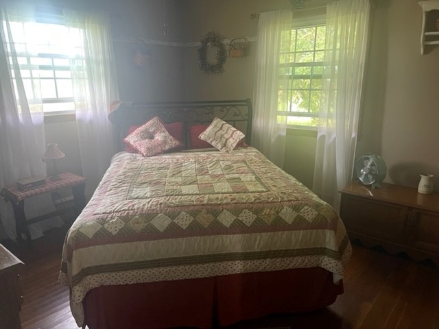 4059 Sunset Road Clinton, IL 61727 - Photo 30 of 55 a bed sitting in a bedroom next to a window
