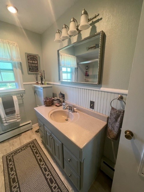 4059 Sunset Road Clinton, IL 61727 - Photo 35 of 55 a bathroom with a sink a mirror and a bathtub