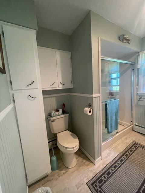 4059 Sunset Road Clinton, IL 61727 - Photo 37 of 55 a bathroom with a toilet and a shower