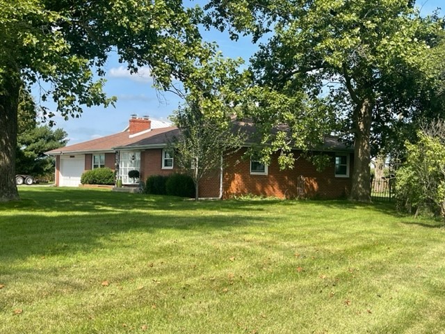 4059 Sunset Road Clinton, IL 61727 - Photo 40 of 55 a front view of a house with a yard
