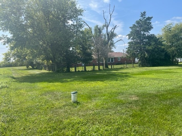 4059 Sunset Road Clinton, IL 61727 - Photo 46 of 55 a backyard of a house with lots of green space and trees