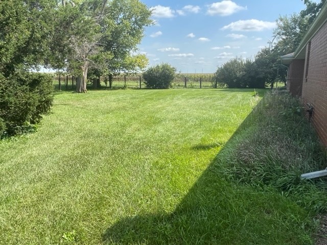4059 Sunset Road Clinton, IL 61727 - Photo 50 of 55 a view of a green field with trees in the background