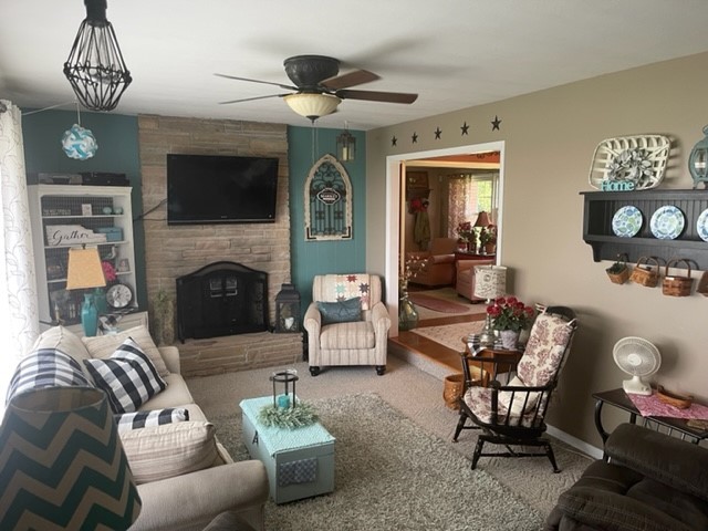 4059 Sunset Road Clinton, IL 61727 - Photo 6 of 55 a living room with furniture and a fireplace