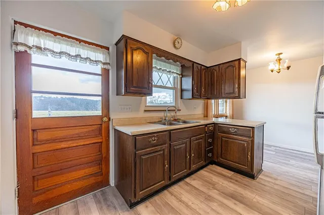 a kitchen with stainless steel appliances granite countertop a sink and cabinets
