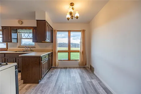a kitchen with a stove and a window