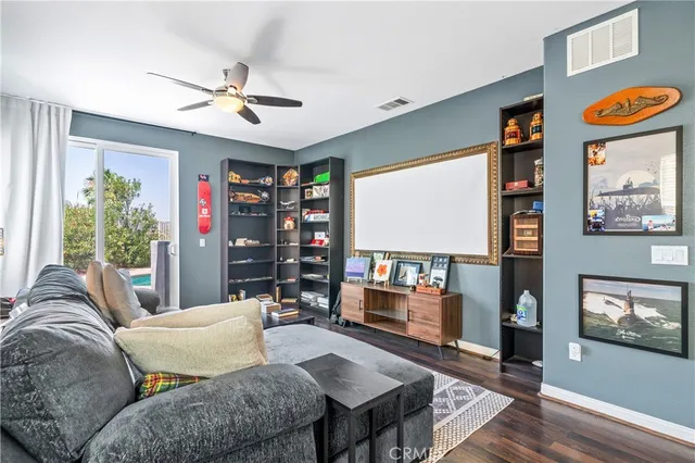 a spacious bedroom with a bed and a chandelier