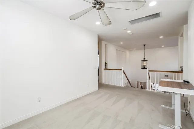 a bathroom with a double vanity sink toilet and a mirror